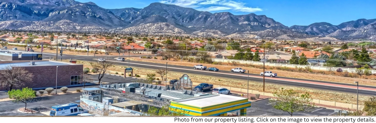 Photo of Canyon de Flores neighborhood with mountain range behind it.
