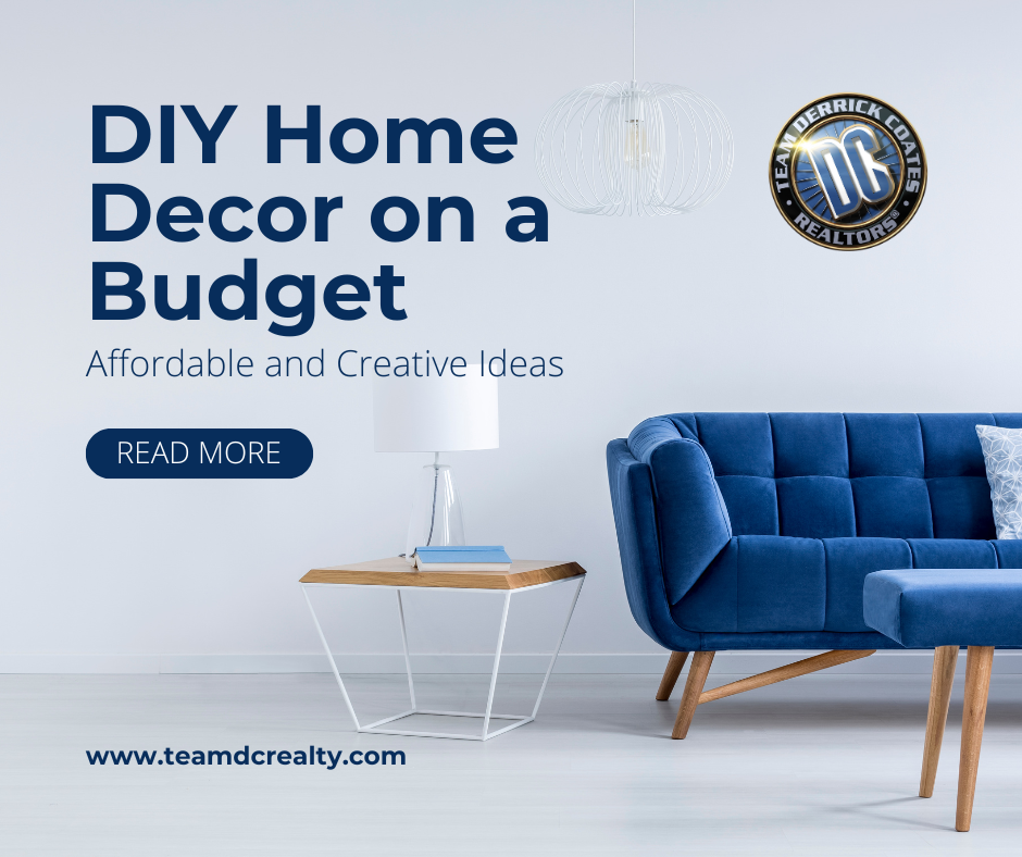 Cropped photo of white living room with blue couch and ottoman with wooden legs and wood topped side table with white lamp.